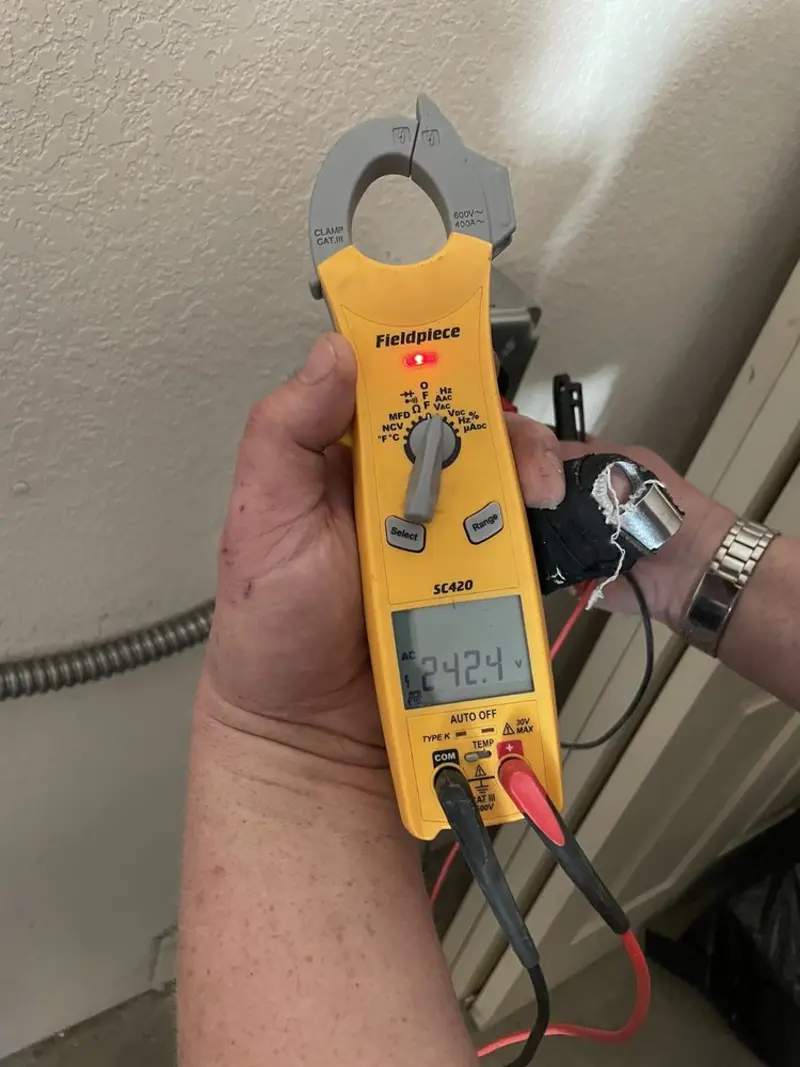 Voltage testing with clamp meter during Electrical Installation Services in Damascus